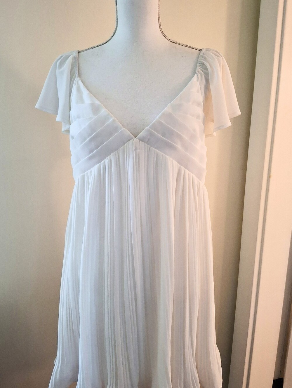 Lulu's White Pleated Dress With Flutter Sleeves And Back Self Tie. SIZE L